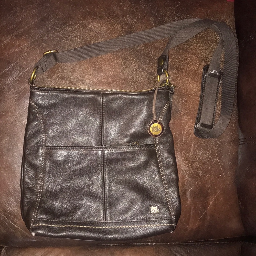 Brown leather messenger SAK purse